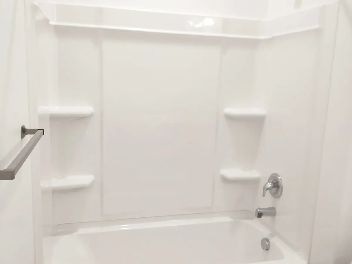 Bathtub surround after a move-out clean, photographed by the Wasatch Cleaners crew