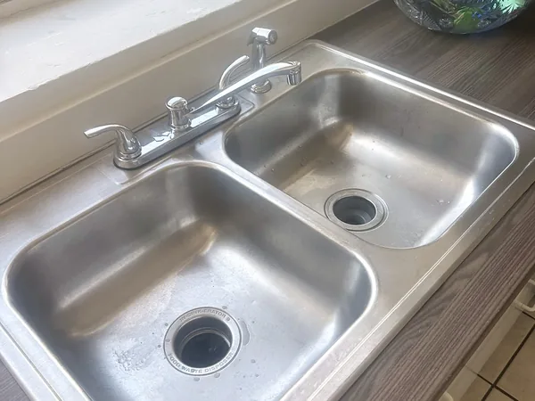 Polished kitchen sink after a Wasatch Cleaners clean
